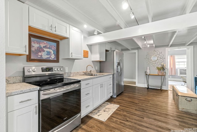 2 Fm 289, Comfort, TX 78013 - kitchen with stainless steel appliances, track lighting, beam ceiling, dark wood-type flooring, and white cabinets