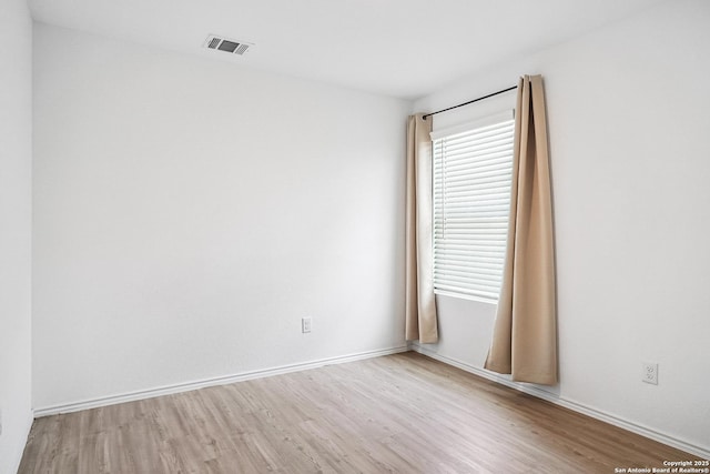 7002 Satellite, San Antonio, TX 78252 - unfurnished room with wood finished floors and baseboards