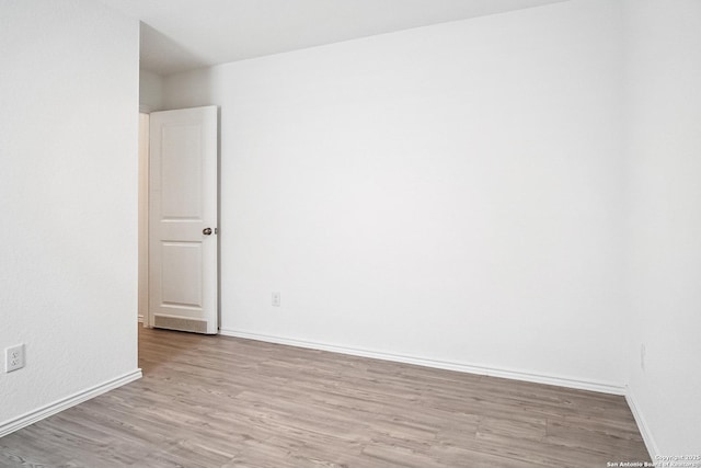 7002 Satellite, San Antonio, TX 78252 - spare room with wood finished floors and baseboards