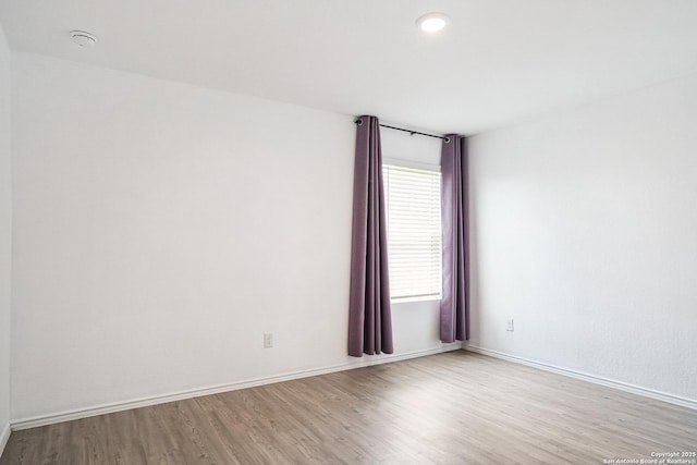 7002 Satellite, San Antonio, TX 78252 - empty room featuring wood finished floors, a smoke detector, and recessed lighting