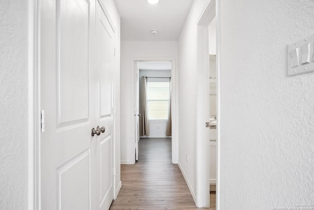 7002 Satellite, San Antonio, TX 78252 - hall with wood finished floors and a textured wall