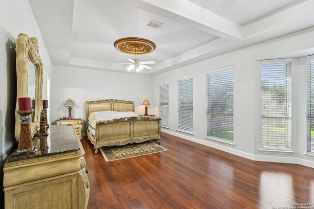 1810 Three Frks, San Antonio, TX 78258 - bedroom featuring a raised ceiling, dark wood-style flooring, and a ceiling fan