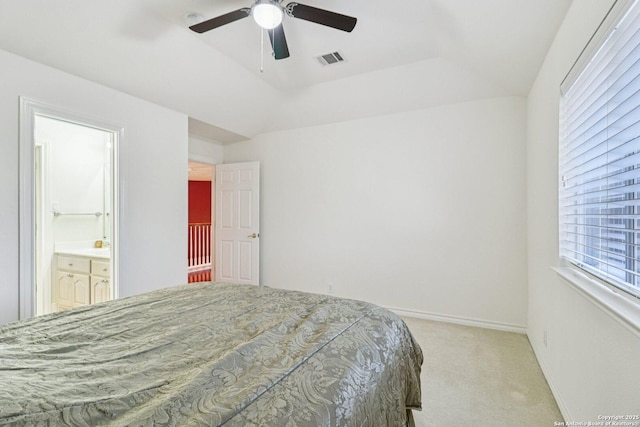 1810 Three Frks, San Antonio, TX 78258 - carpeted bedroom featuring a tray ceiling, connected bathroom, and a ceiling fan