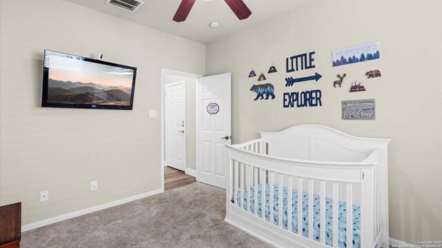 21810 Thunder Basin, San Antonio, TX 78261 - carpeted bedroom with a crib and a ceiling fan