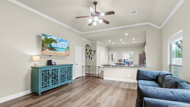 21810 Thunder Basin, San Antonio, TX 78261 - living room featuring wood finished floors, ceiling fan, recessed lighting, and crown molding