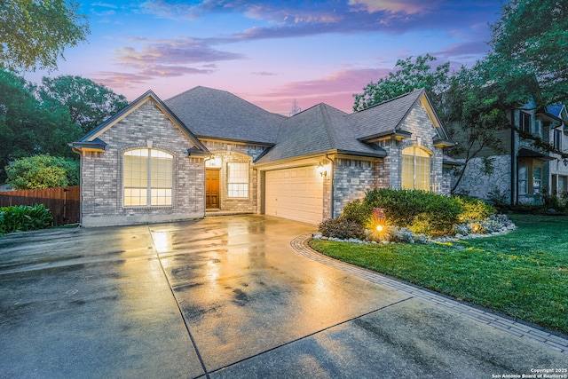 4481 Owl Crk, Schertz, TX 78154 - french provincial home featuring a shingled roof, driveway, brick siding, and an attached garage