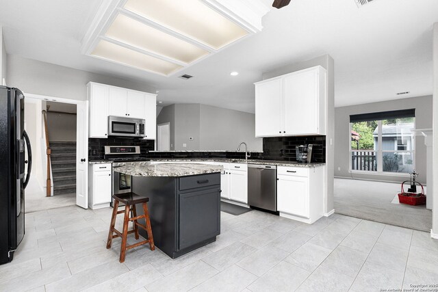4481 Owl Crk, Schertz, TX 78154 - kitchen with appliances with stainless steel finishes, backsplash, white cabinetry, light stone countertops, and recessed lighting