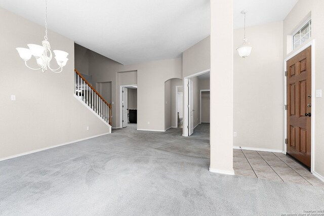 4481 Owl Crk, Schertz, TX 78154 - carpeted entryway featuring arched walkways, a chandelier, and stairs