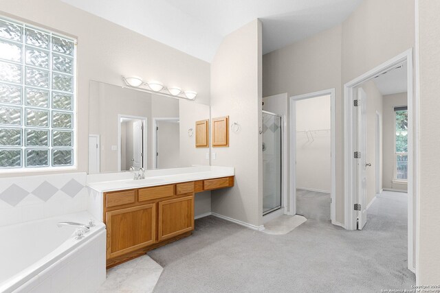 4481 Owl Crk, Schertz, TX 78154 - bathroom featuring a stall shower, vanity, a garden tub, and a spacious closet