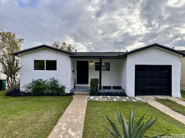 414 Clower, San Antonio, TX 78212 - view of front facade with stucco siding, a front lawn, and an attached garage