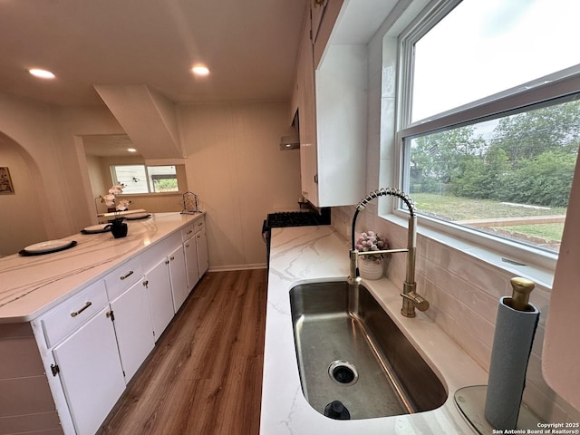 414 Clower, San Antonio, TX 78212 - kitchen featuring plenty of natural light, a peninsula, wood finished floors, white cabinetry, and recessed lighting