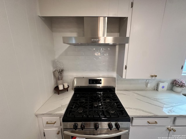 414 Clower, San Antonio, TX 78212 - kitchen featuring wall chimney range hood, stainless steel gas stove, white cabinets, and light stone countertops