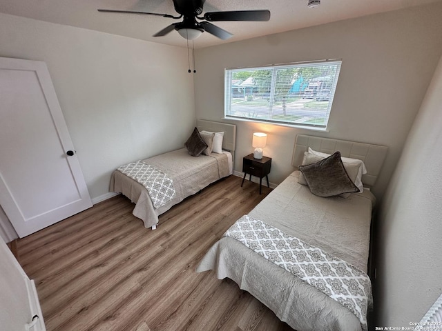 414 Clower, San Antonio, TX 78212 - bedroom featuring light wood finished floors and a ceiling fan