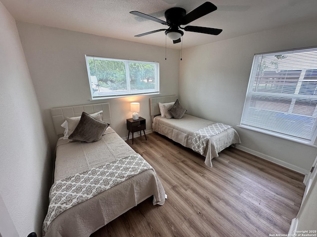 414 Clower, San Antonio, TX 78212 - bedroom with wood finished floors and ceiling fan