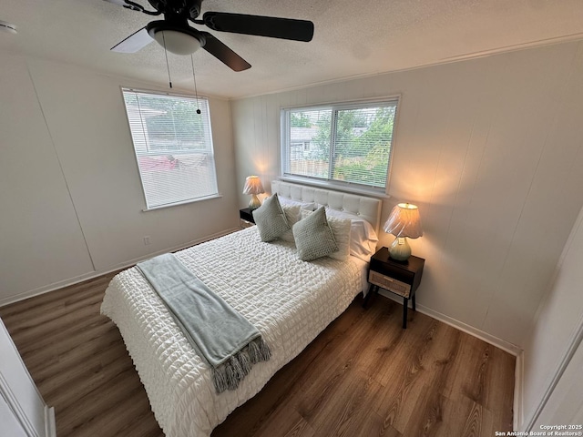 414 Clower, San Antonio, TX 78212 - bedroom with wood finished floors, a textured ceiling, and a ceiling fan
