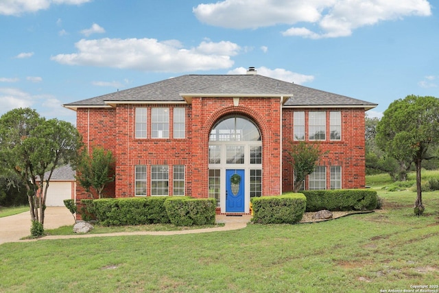 23613 Grayling Ln, San Antonio, TX 78259 - view of front of property with brick siding, a front yard, roof with shingles, concrete driveway, and a garage