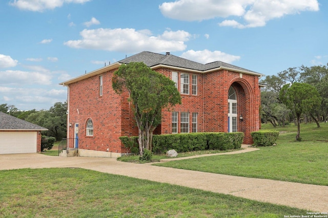 23613 Grayling Ln, San Antonio, TX 78259 - traditional home featuring brick siding, a front yard, and driveway