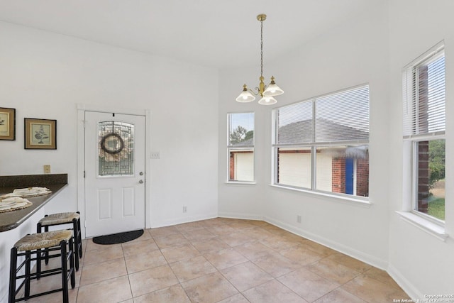 23613 Grayling Ln, San Antonio, TX 78259 - unfurnished dining area featuring a chandelier and light tile patterned flooring