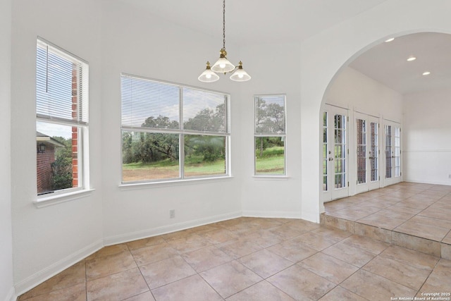 23613 Grayling Ln, San Antonio, TX 78259 - unfurnished dining area with a chandelier, tile patterned flooring, arched walkways, and recessed lighting