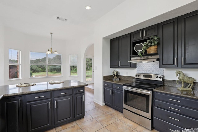 23613 Grayling Ln, San Antonio, TX 78259 - kitchen with stainless steel range with electric cooktop, arched walkways, healthy amount of natural light, light tile patterned flooring, and recessed lighting