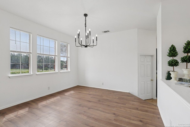 23613 Grayling Ln, San Antonio, TX 78259 - unfurnished dining area with a chandelier and wood finished floors