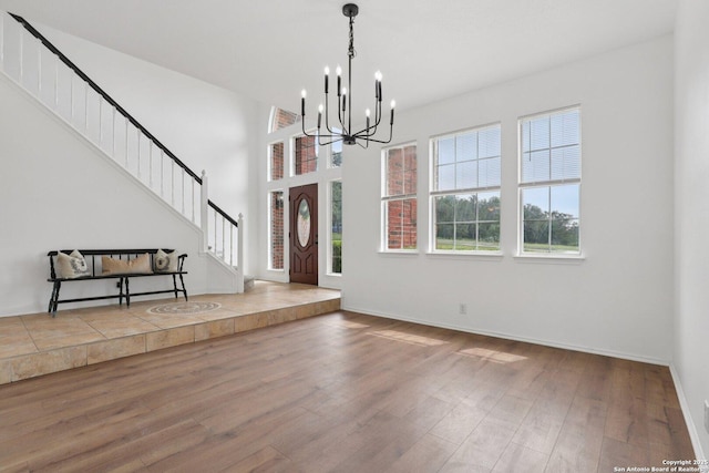 23613 Grayling Ln, San Antonio, TX 78259 - entryway featuring a chandelier, wood finished floors, and stairway