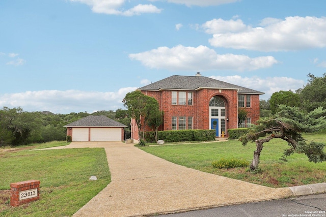 23613 Grayling Ln, San Antonio, TX 78259 - view of front of property featuring a detached garage, a front lawn, and brick siding