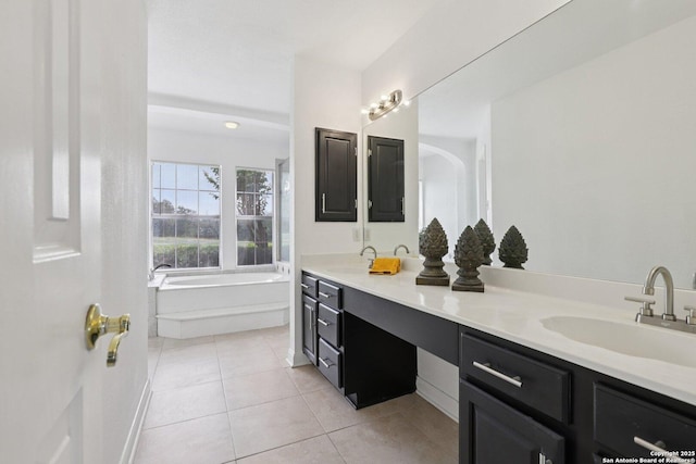 23613 Grayling Ln, San Antonio, TX 78259 - bathroom with double vanity, tile patterned floors, and a garden tub