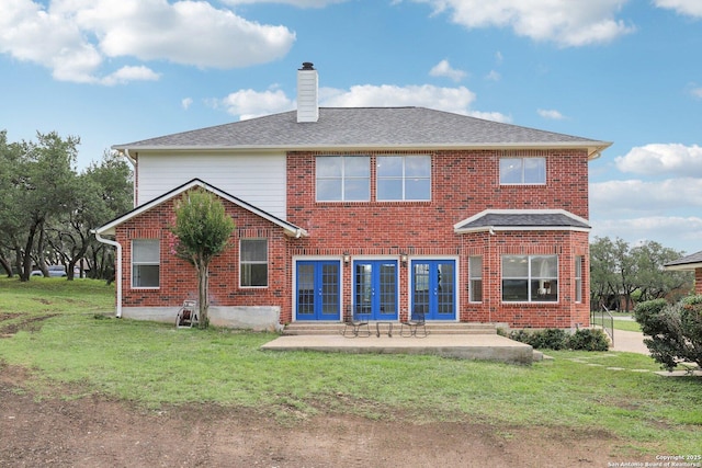 23613 Grayling Ln, San Antonio, TX 78259 - back of house featuring a chimney, a yard, a patio area, and brick siding