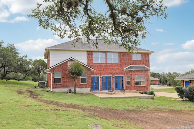 23613 Grayling Ln, San Antonio, TX 78259 - back of property featuring brick siding, a patio area, and a yard