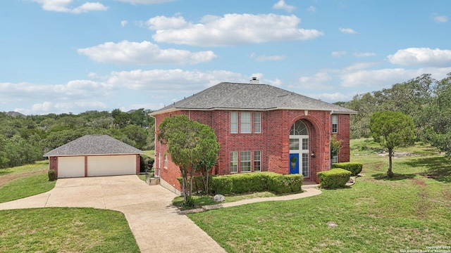 23613 Grayling Ln, San Antonio, TX 78259 - view of front of house featuring an outbuilding, a garage, a front yard, brick siding, and a chimney