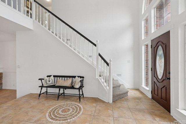 23613 Grayling Ln, San Antonio, TX 78259 - tiled foyer featuring a towering ceiling, stairway, and healthy amount of natural light