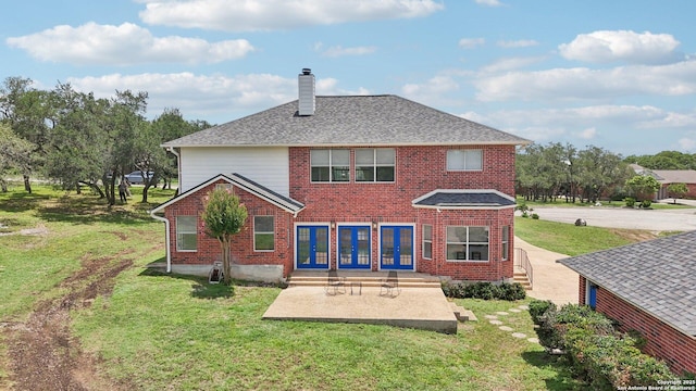 23613 Grayling Ln, San Antonio, TX 78259 - back of house with brick siding, a chimney, and a yard