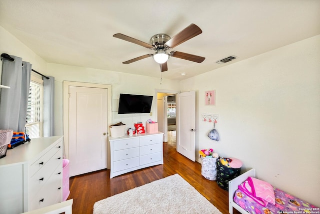 702 John Adams, San Antonio, TX 78228 - bedroom with dark wood finished floors and ceiling fan