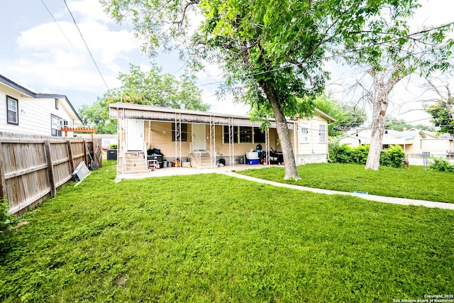 702 John Adams, San Antonio, TX 78228 - rear view of property featuring a fenced backyard, a patio area, and entry steps