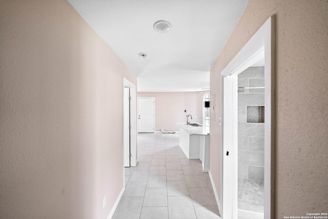 702 John Adams, San Antonio, TX 78228 - hall featuring a sink and light tile patterned floors