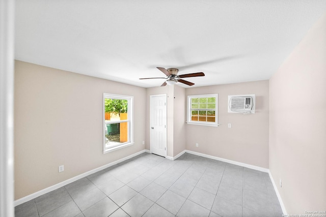 702 John Adams, San Antonio, TX 78228 - unfurnished bedroom featuring a wall mounted air conditioner, a ceiling fan, tile patterned floors, and a closet