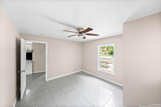 702 John Adams, San Antonio, TX 78228 - empty room with ceiling fan and light tile patterned floors