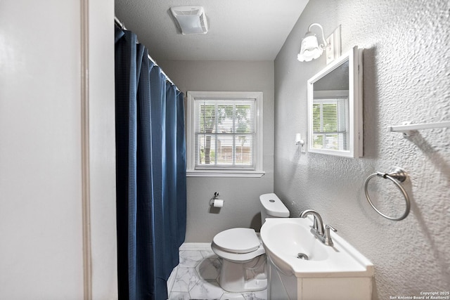 702 John Adams, San Antonio, TX 78228 - full bathroom featuring marble look tile flooring, a textured wall, and a shower with shower curtain