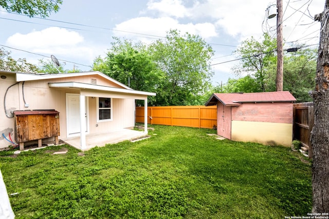 702 John Adams, San Antonio, TX 78228 - fenced backyard with a shed and a patio area