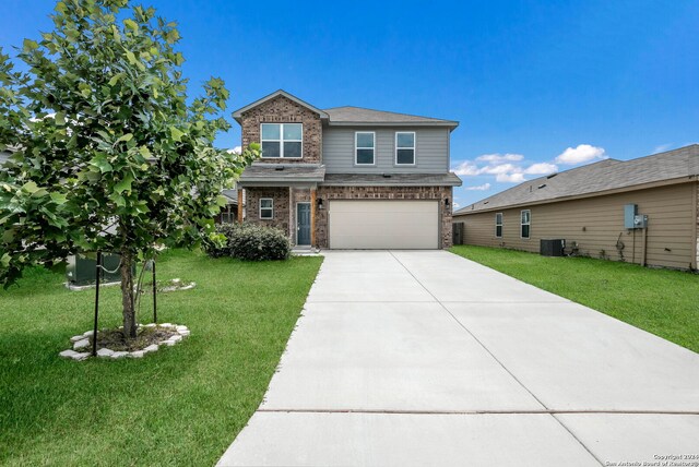 12810 Olson Pt, San Antonio, TX 78252 - view of front of property featuring concrete driveway, a garage, a front lawn, and brick siding