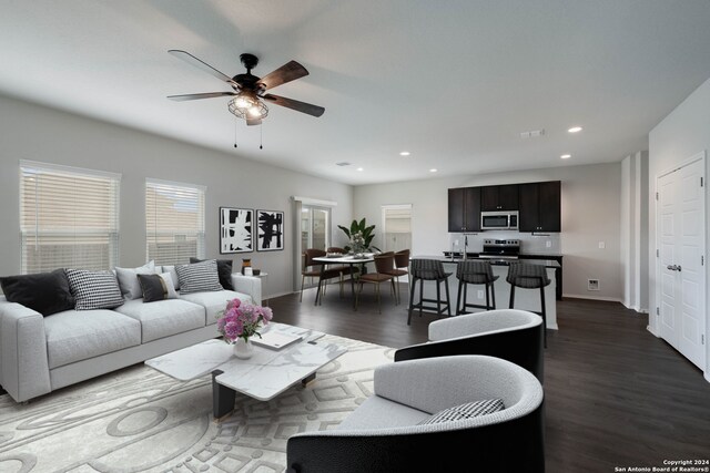 12810 Olson Pt, San Antonio, TX 78252 - living room featuring a ceiling fan, dark wood finished floors, and recessed lighting