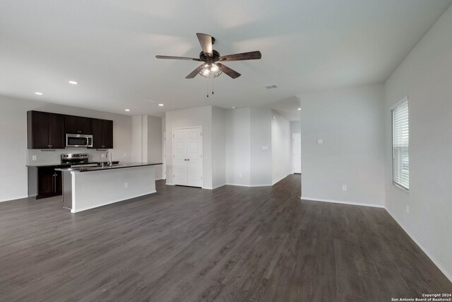 12810 Olson Pt, San Antonio, TX 78252 - unfurnished living room featuring a ceiling fan, recessed lighting, and dark wood-style floors