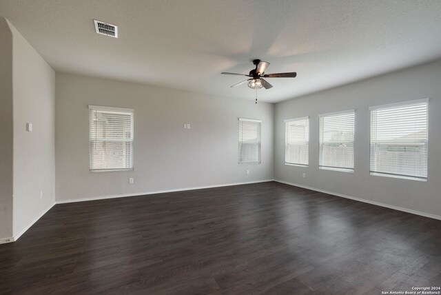 12810 Olson Pt, San Antonio, TX 78252 - empty room with ceiling fan and dark wood-type flooring