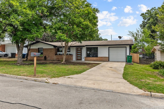 4426 Newcome, San Antonio, TX 78229 - view of front of home featuring brick siding, a garage, and driveway