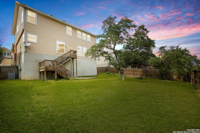 4922 Augusta, San Antonio, TX 78247 - back of property at dusk featuring stairs and a fenced backyard