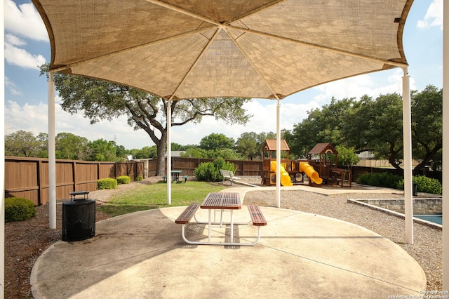 4922 Augusta, San Antonio, TX 78247 - fenced backyard with a playground and a patio area