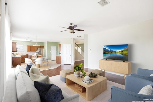 4922 Augusta, San Antonio, TX 78247 - living area featuring stairs, light wood-type flooring, and a ceiling fan