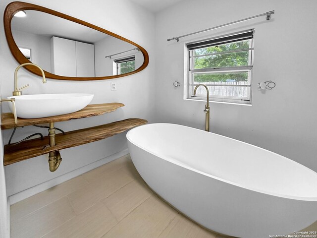 737 N Central, New Braunfels, TX 78130 - full bath featuring a freestanding bath and healthy amount of natural light