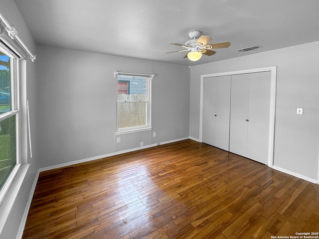 737 N Central, New Braunfels, TX 78130 - unfurnished bedroom with wood-type flooring, a closet, and a ceiling fan